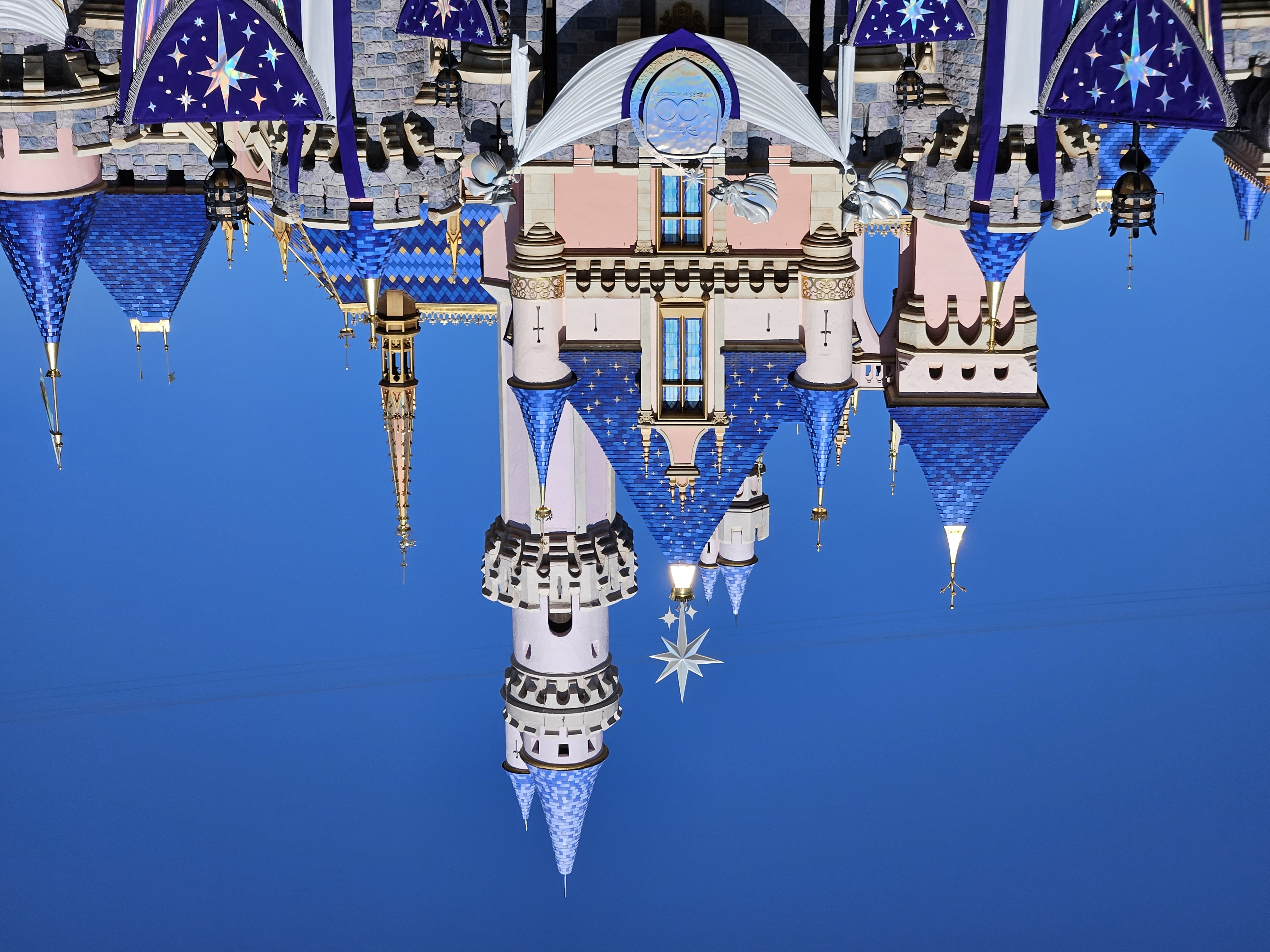 A photo of Sleeping Beauty Castle at Disneyland decorated in Disney100 decorations taken with Samsung Galaxy S23